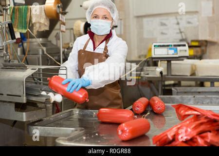 Sausage. Sausage production line. Process of sausage manufacturing ...