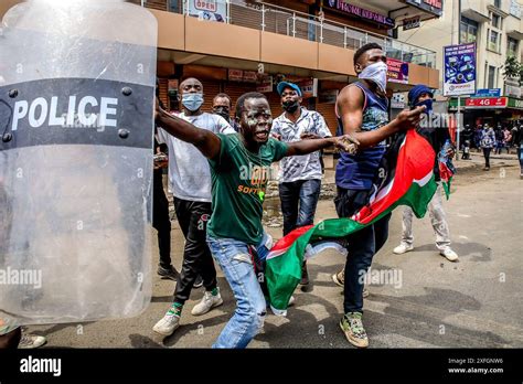 Nairobi Kenya 2nd July 2024 Angry Protesters Carrying A Police Shield And A Kenyan Flag