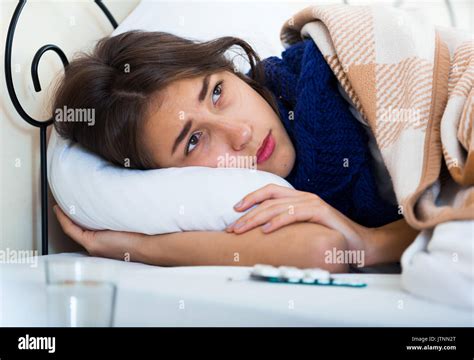 Sad Teenage Girl With High Fever And Flu In Bed Stock Photo Alamy