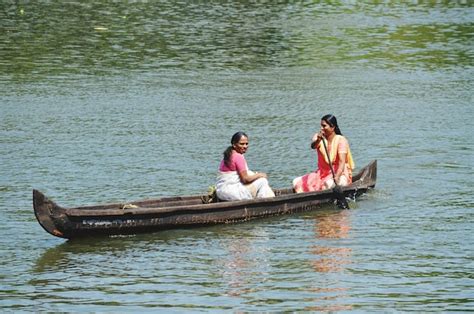 Premium Photo Women In Rowing Boat On Lake