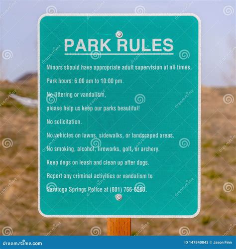 Clear Square Close Up Of A Park Rules Signage Against A Rocky And