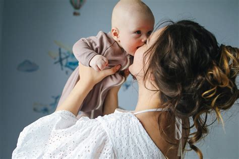 Mother Kissing Her Cute Baby · Free Stock Photo