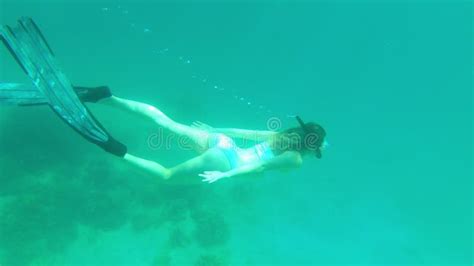 Woman Snorkel And Swimming In Coral Reef In Ocean Exploration And