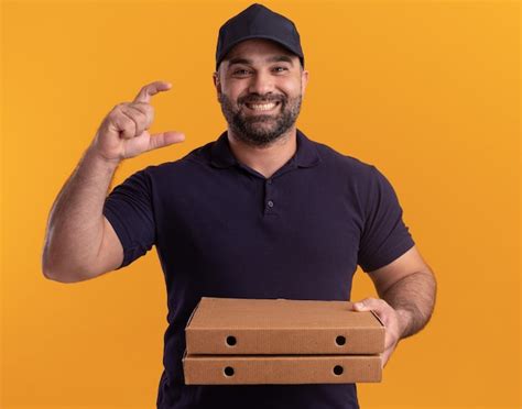 Free Photo Smiling Middle Aged Delivery Man In Uniform And Cap