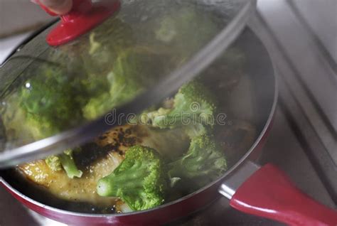 Broccoli Frying In Red Pan Stock Photo Image Of Brocoli 105392372