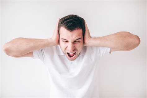 premium photo young mad man isolated  white wall guy screaming