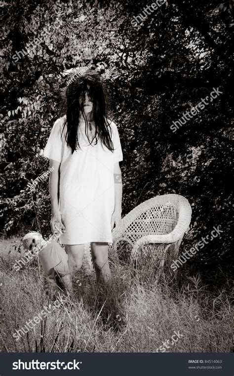 Horror Scene Woman Possessed Holding Doll Stock Photo