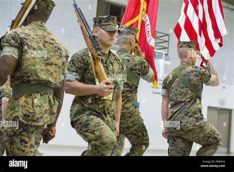 Marines With The 23rd Regimental Color Guard March To Colors During A