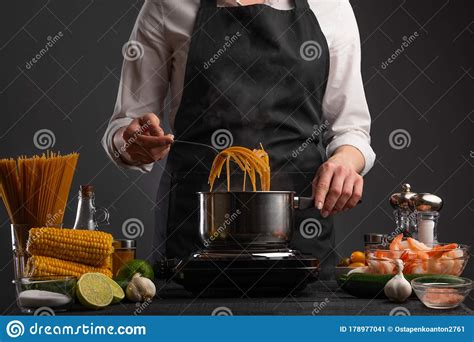 Professional Pasta Cook With Italian Pasta With Shrimps And Vegetables