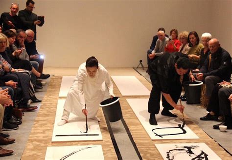 Japanese calligraphers demonstrate the art of Japanese calligraphy