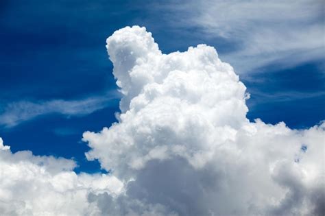 Premium Photo Blue Sky Background With Tiny Clouds