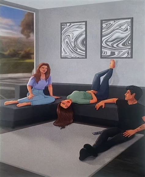 Three People Are Sitting On A Couch And One Person Is Laying Down In