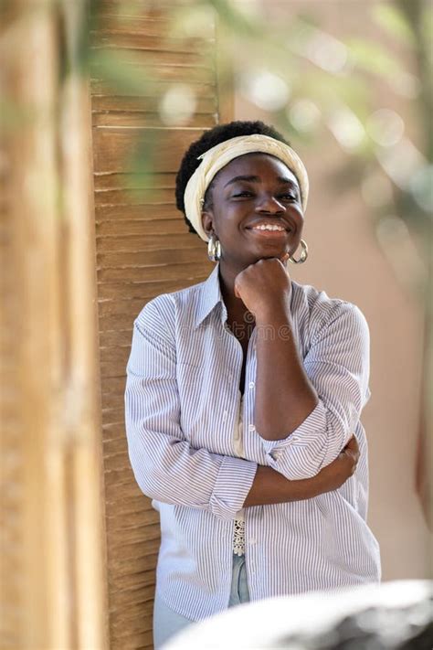 A Smiling African American Plus Size Woman Looking Contented Stock