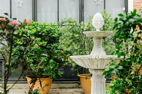 Beautiful fountain statue in the garden Stock Photo | Adobe Stock