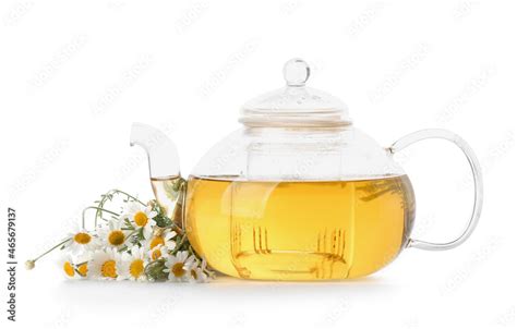 Teapot Of Tasty Tea With Chamomile Flowers On White Background Stock