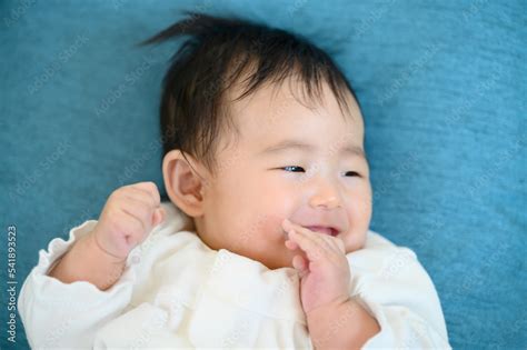 Smiling baby with a very cute smile. Stock Photo | Adobe Stock