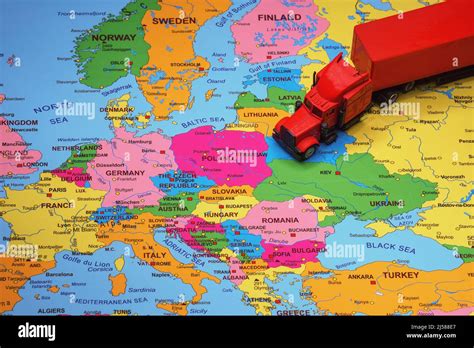 Red truck with trailer on the Europe map Stock Photo - Alamy