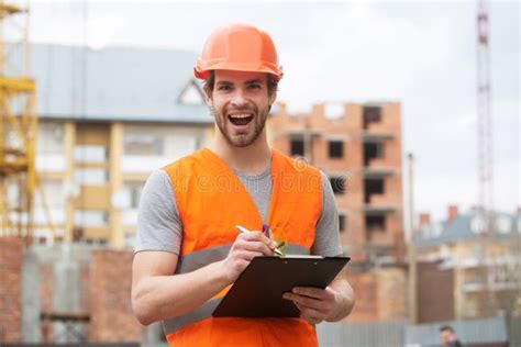 Portrait Of Construction Builder Construction Worker Man In Work Clothes And A Construction