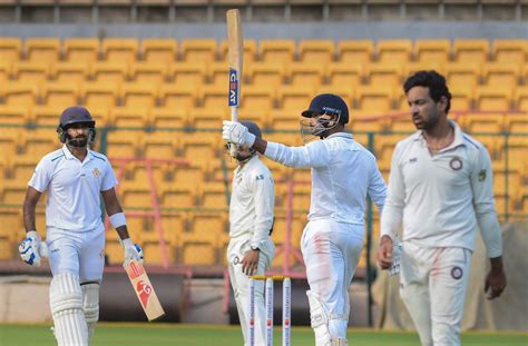 Mayank Agarwal raises his bat after completing his half-century ...