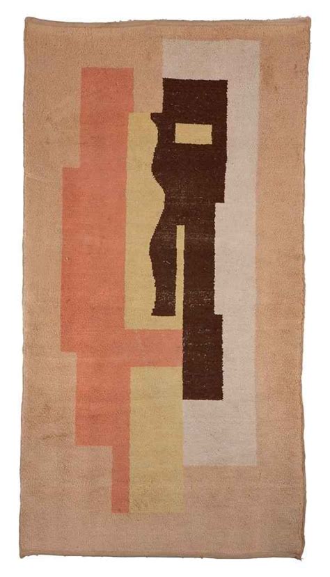 A Rug With An Abstract Design On The Front And Back Of It In Various