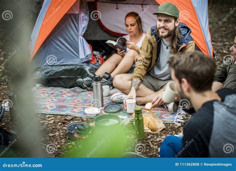 Friends Camping In The Forest Together Stock Photo Image Of Cheerful