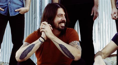 Understanding the Symbolic Meaning: Behind Dave Grohl's Tattoo of a Feather