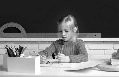 Back To School. Cute Pupil Girl Drawing at the Desk. Genius Child ...