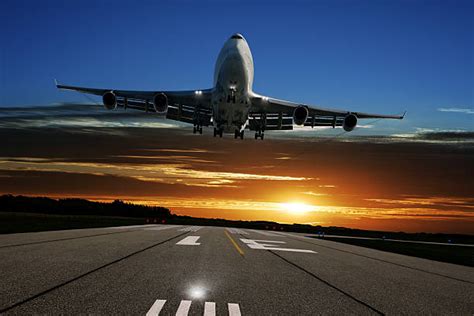 Landing Airplane Boeing 747 Sunset Stock Photos Pictures And Royalty