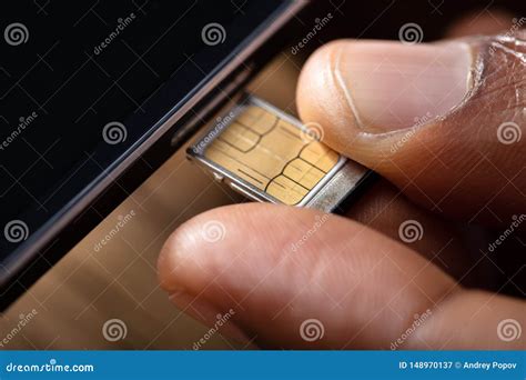 Person Inserting Sim Card In Cellphone Stock Image Image Of Inserting