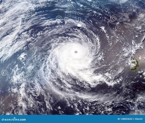 Tropical Cyclone With Intense Clouds And Lightning Rolling Over