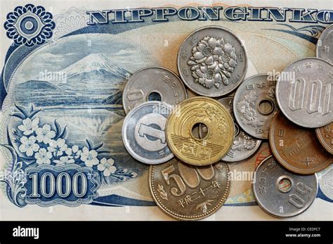 Japanese yen banknotes and coins Stock Photo - Alamy