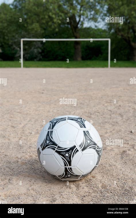 Football On Sand Pitch With Goalposts In The Background Stock Photo Alamy