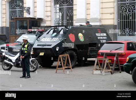 A Policeman And An Armored Vehicle In Lima Peru Stock Photo Alamy