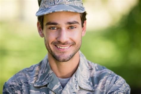 Portrait of soldier smiling in park from Pikwizard