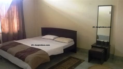 Comfortable Deluxe Beds Inside Rooms At The Prashanti Tourist Lodge At