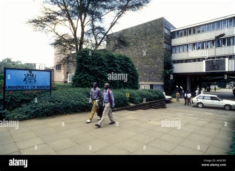 Two Male Students Stride Out Of The Faculty Of Arts Of Nairobi