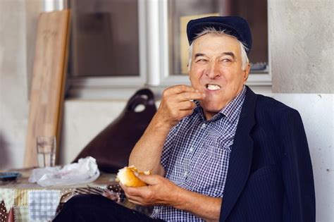 Premium Photo Portrait Of Smiling Man Holding Ice Cream