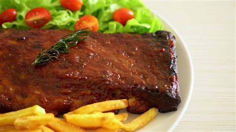 grilled and barbecue ribs pork with BBQ sauce 8640278 Stock Video at Vecteezy