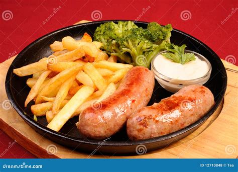 Hot Sausages and Fried Potatoes Stock Photo - Image of meal, heap: 12710848