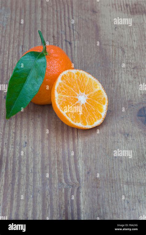 Satsuma oranges on wood background Stock Photo - Alamy