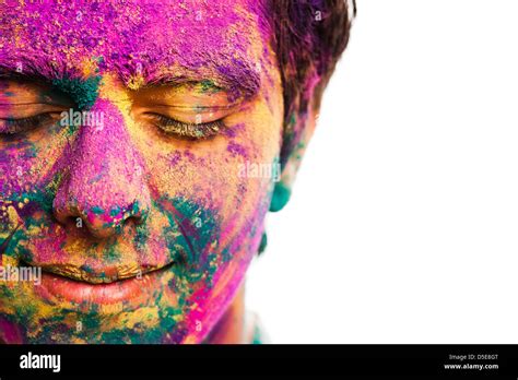mans face covered  powder paint  holi festival stock photo