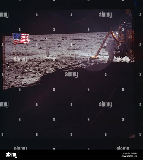 The American flag and Lunar landing module on the moon during July 20, 1969's history making ...