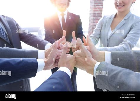 business team showing thumbs up Stock Photo - Alamy