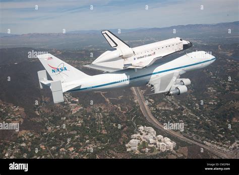 NASA Shuttle Carrier Aircraft carrying space shuttle Endeavour soars over the J. Paul Getty ...