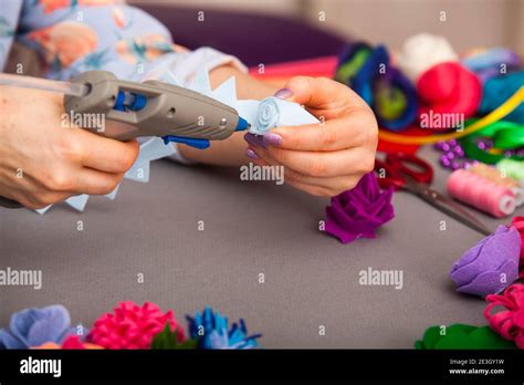 Woman modelling artificial flower from clay Stock Photo - Alamy