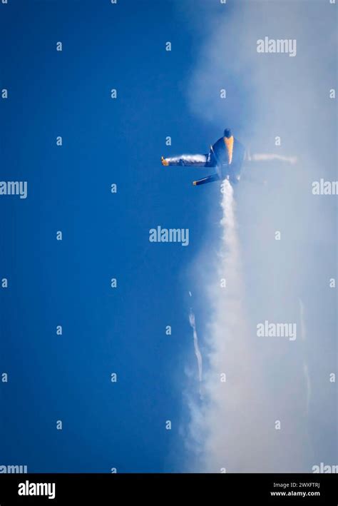 Beyond The Smoke Trail Vapor Break Around The Wings Of A US Navy Blue