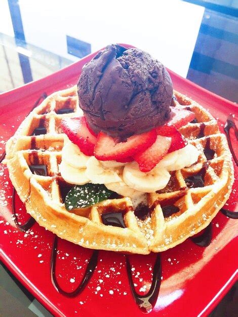 Premium Photo Close Up Of Waffle Ice Cream In Plate On Table