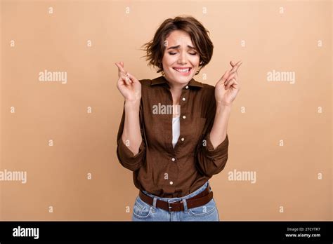 Photo Of Doubtful Unsure Lady Wear Brown Shirt Biting Lip Fingers