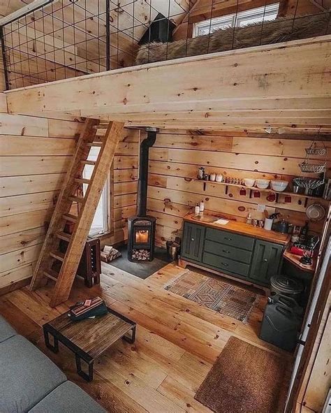 An Instagram Photo Of A Living Room In A Log Cabin With Stairs Leading