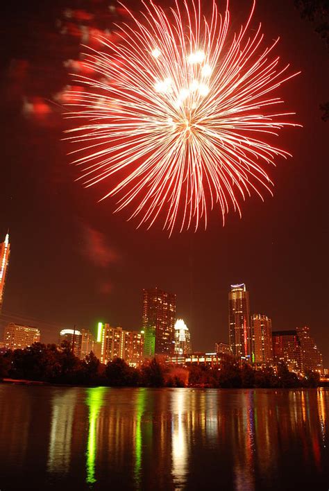 A Red Fire Ball Fireworks Over Austin Photograph by Jennifer Holcombe